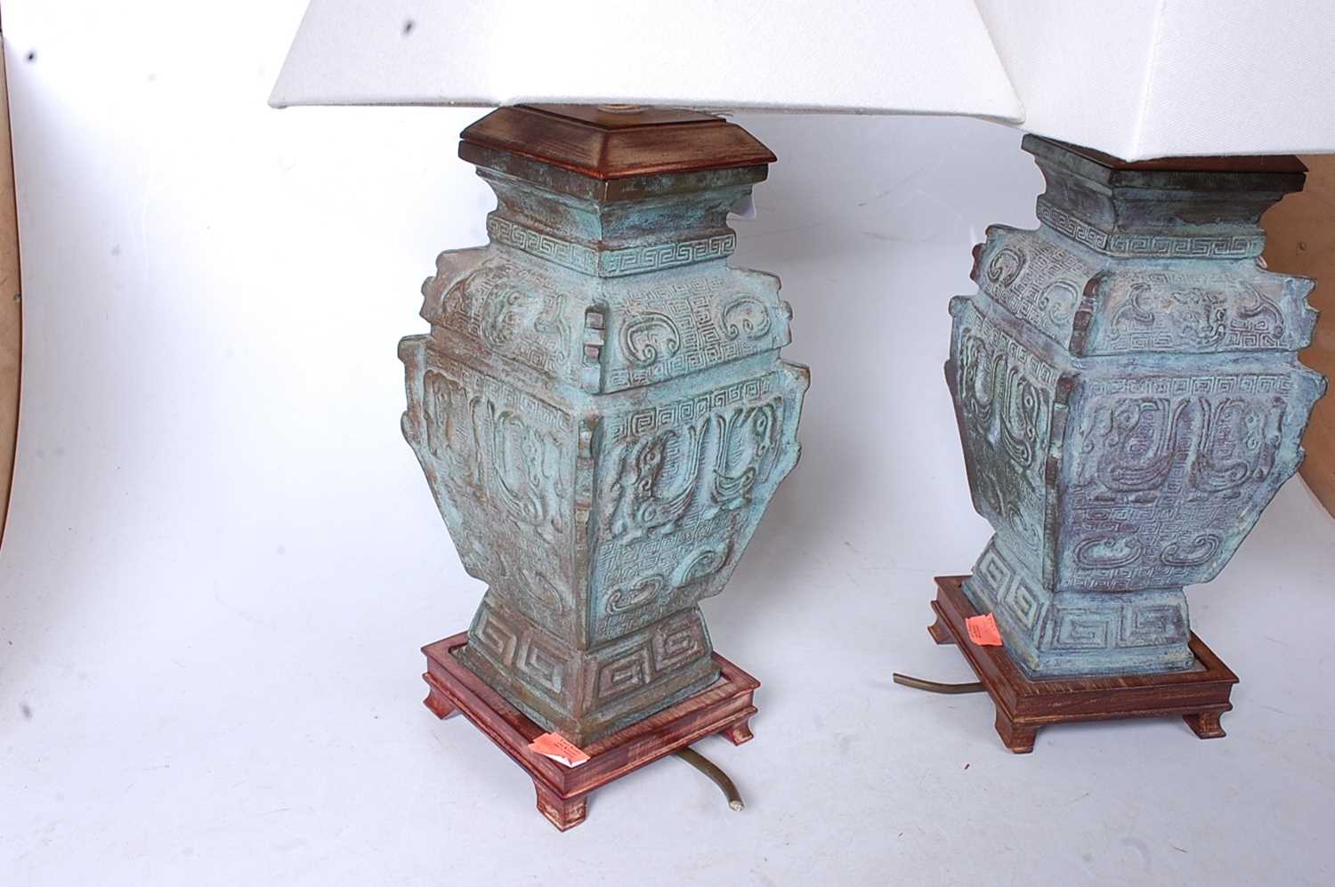 A pair of Chinese bronze table lamps, of square section, having incised Greek Key type decoration - Image 2 of 2