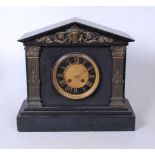 A late Victorian black slate mantel clock, of architectural form, having a matt dial with black