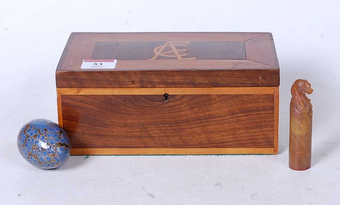 An early 20th century rosewood, boxwood, and yew wood glove box of hinged rectangular form,