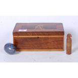 An early 20th century rosewood, boxwood, and yew wood glove box of hinged rectangular form,