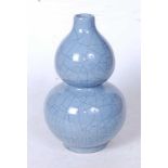 A Chinese blue crackle glazed double gourd vase, having blue seal mark verso, height 24cm