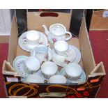 An early 20th century tete-a-tete tea service, with lustre glaze and floral decoration; together