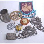 A collection of miscellaneous items to include a brass trivet, pewter tankard, pressed metal dragon,