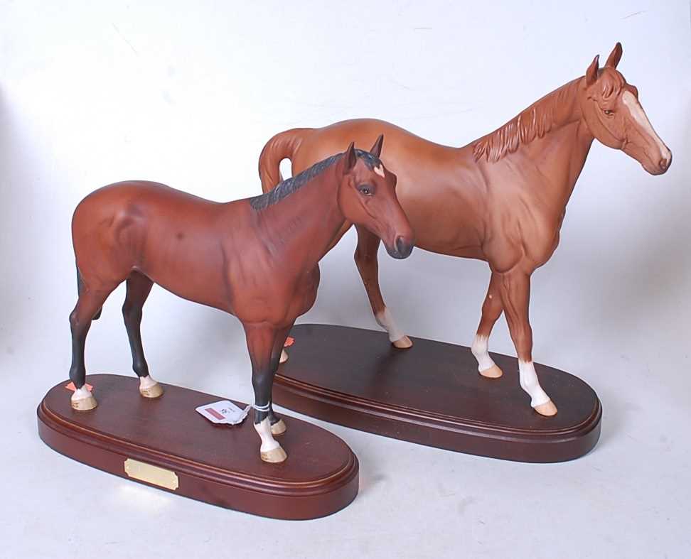 A Royal Doulton figure of the racehorse Nijinsky, on an oval base with brass plaque, having