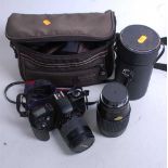 A Canon EOS 500N camera in Optex camera bag together with a Japanese Auto Makinon lens in case