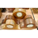An Edwardian mahogany and boxwood strung mantel clock of shaped form having a circular dial with