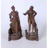 A pair of 19th century French spelter figures, each shown in 18th century dress descending a