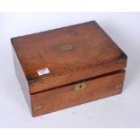 A Victorian walnut and brass bound writing slope of plain rectangular form, the hinged lid opening