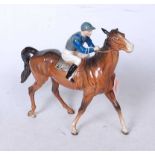 A Beswick racehorse and jockey (walking racehorse), model No.1037, colourway No.2, number on