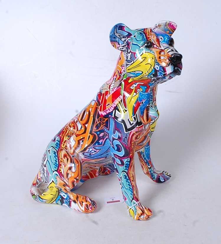 A modern model of a seated dog, with all-over decoupage type decoration, h.36cm