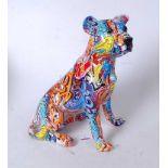 A modern model of a seated dog, with all-over decoupage type decoration, h.36cm