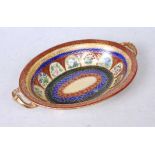A Royal Doulton porcelain oval twin handled dish, having gilt and floral decoration, w.27cmCondition