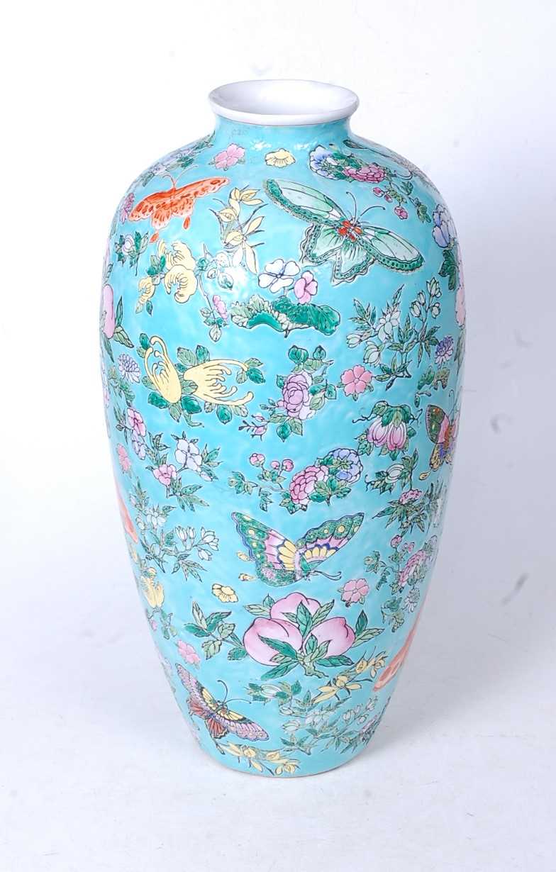 A Chinese export Meiping vase, on a turquoise ground enamel decorated with butterflies and