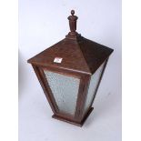 A mid-20th century oak framed and glazed hall light pendant, of square tapered form, h.58cm.