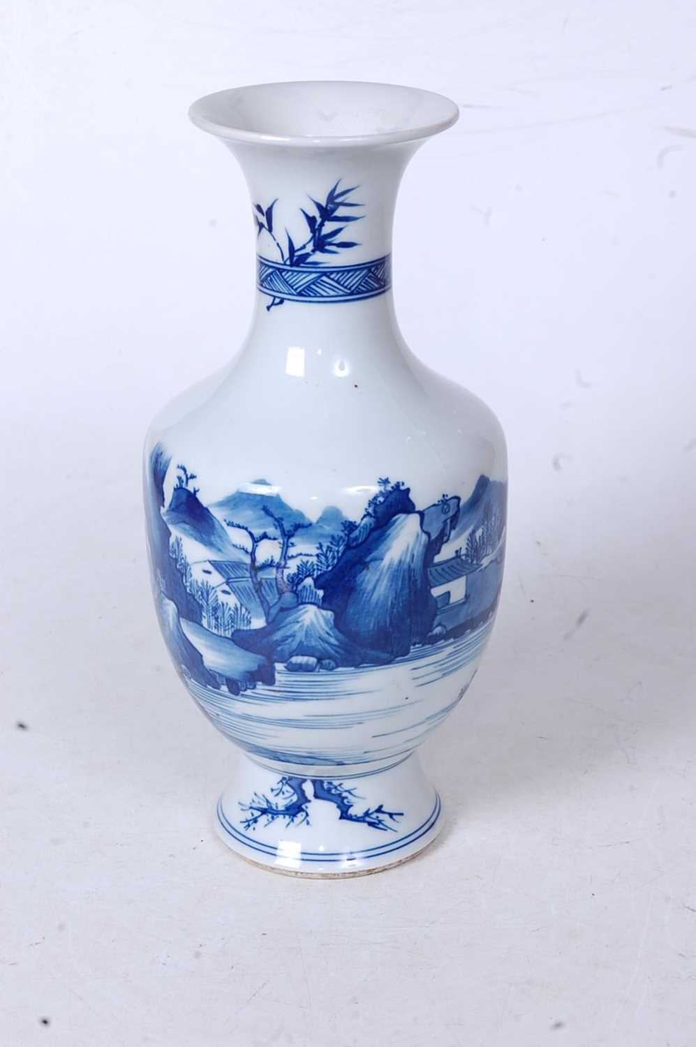 A Chinese export blue and white vase, having a flared rim to a slender neck and bulbous lower - Image 2 of 5
