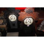 A late 19th century American walnut cased gingerbread type clock, having a painted circular dial