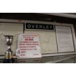 A framed display relating to overly LNWR railway to include map arrivals and departures and a