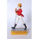 A reproduction painted resin Johnnie Walker Scotch Whisky advertising figure, h.35cm