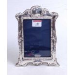 A modern silver clad easel photo frame in the Art Nouveau style, 21x15cm