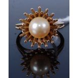 A modern yellow metal and cultured pearl set dress ring, unmarked but tests as 9ct, 6.1g, size N