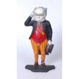 A reproduction painted cast iron doorstop in the form of a man in standing pose with top-hat in