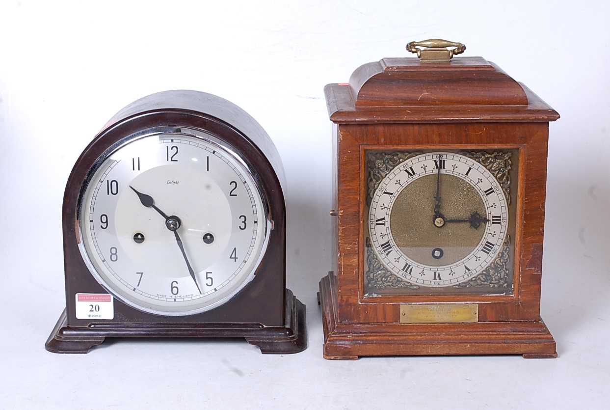 A mid-20th century walnut cased mantel clock, in the 18th century style, having a silvered dial with