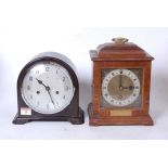 A mid-20th century walnut cased mantel clock, in the 18th century style, having a silvered dial with