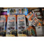 A collection of modern issue Matchbox and Hot Wheels gift sets, many being single carded items, some