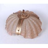A 1930s pink tinted moulded glass and brass mounted ceiling light fitting, of shell shape, 33cm