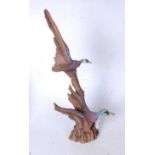 A J.H. Boone Native American sculpture of ducks, numbered 246/1000, bearing label verso 'A Walk in