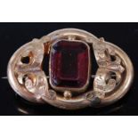 A late Victorian pinchbeck and amethyst set brooch 38mm