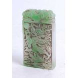 A faux jade pendant, carved as a dragon chasing a pearl, 9 x 5cm