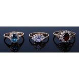 A 9ct gold, amethyst and cz set dress ring, size M; together with a 9ct gold, blue zircon and