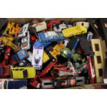 A box containing a large quantity of playworn diecast models by Corgi, Dinky, Matchbox and others