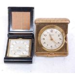 A small gilt brass travel clock, in folding lacquered case, in original box; together with one other
