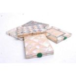 A collection of five various Victorian mother of pearl and abalone shell visiting card cases