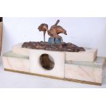 An Art Deco onyx and polished hardstone mantel clock case, mounted with a spelter model of birds,