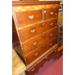 A George III oak chest on stand, the upper section with two short over three long drawers, the stand