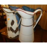 Four various enamelled metal single handled water jugs