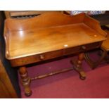 A mid-Victorian mahogany three-quarter gallery back round cornered two-drawer hall table, raised