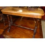 A mid-Victorian walnut round cornered hall table raised on turned supports, width 90cm