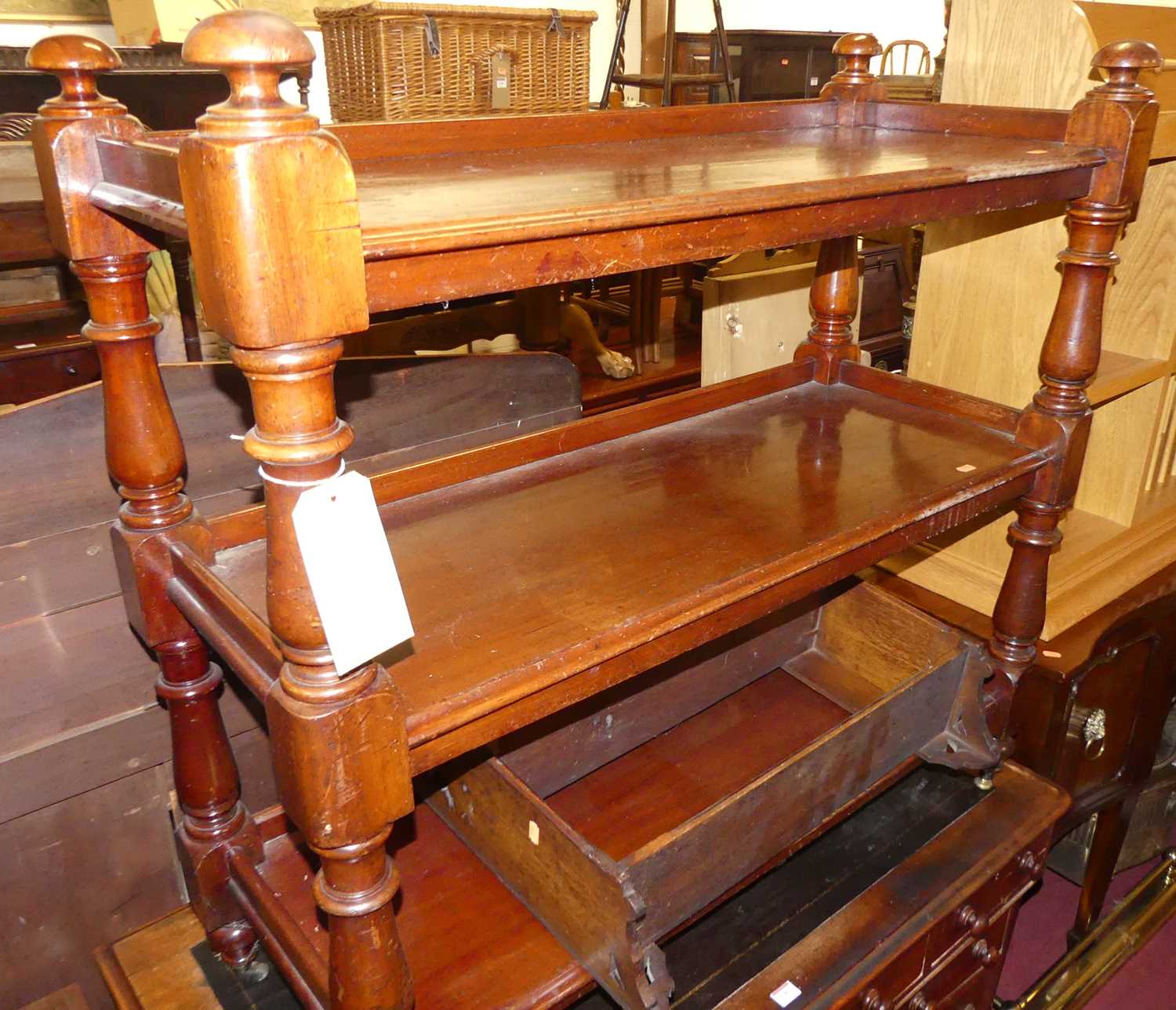 A mid-Victorian mahogany three-tier buffet whatnot, raised on turned and square cut columns, w.