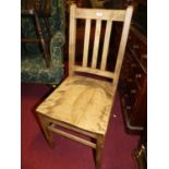 An early 20th century beech slat back single kitchen chair