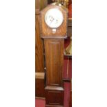 A 1930s oak grandmother clock, the worn silvered dial with twin winding holes, height 151cm