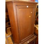 A 19th century oak low single door corner cupboard