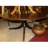 A Regency style mahogany D-end extending single pillar dining table, having pull-out action (lacking