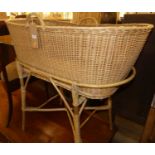 A wicker 'Moses' basket on stand