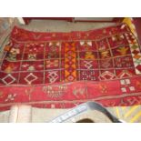 A Caucasian red ground heavy woven geometric decorated floor rugCondition report: 192x290cm