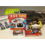 A box to include an assortment of boxed radio controlled cars, including Drone Helicopter, Mighty