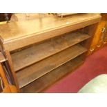 A 1930s oak low freestanding open bookshelf, w.135cm